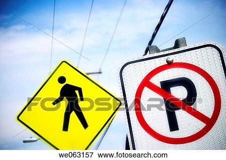 A? no parking? sign in front of a yellow? walk? sign. View Large Photo Image Stock Photo - A? no parking? sign in front of a yellow? walk? sign.. Fotosearch