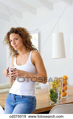 absorbed, brunette, at-home, 20's View Large Photo Image Stock Photo - absorbed, brunette, at-home, 20's. Fotosearch