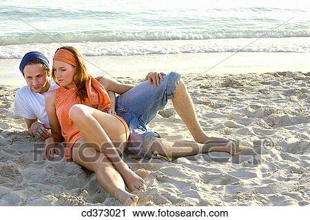 affection, bond, beach, barefoot, 20's View Large Photo Image Stock Image - affection, bond, beach, barefoot, 20's. Fotosearch