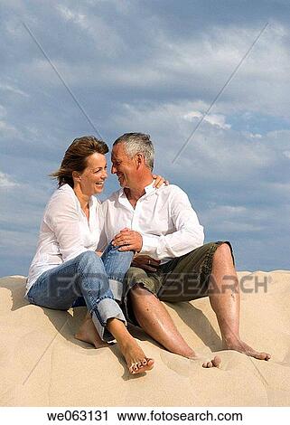 amusement, bond, beach, barefoot, affection View Large Photo Image Stock Image - amusement, bond, beach, barefoot, affection. Fotosearch