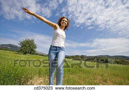 Stock Image - amusement, brunette, Arms open, 20's. Fotosearch