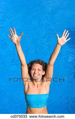amusement, brunette, blue, Arms raised, 20's View Large Photo Image Stock Image - amusement, brunette, blue, Arms raised, 20's. Fotosearch