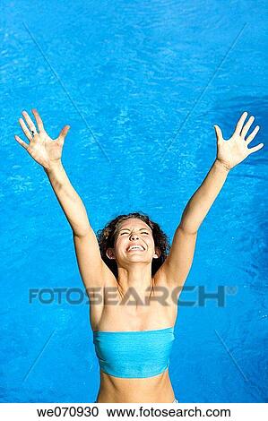 amusement, brunette, blue, Arms raised, 20's View Large Photo Image Stock Image - amusement, brunette, blue, Arms raised, 20's. Fotosearch