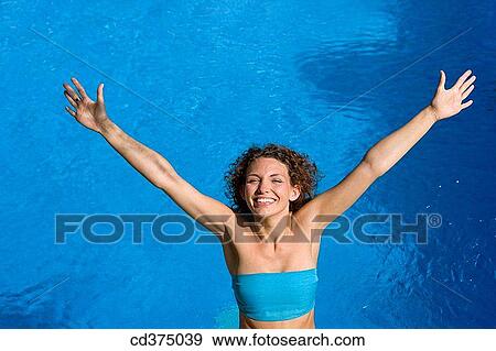 amusement, brunette, blue, Arms raised, 20's View Large Photo Image Stock Photo - amusement, brunette, blue, Arms raised, 20's. Fotosearch