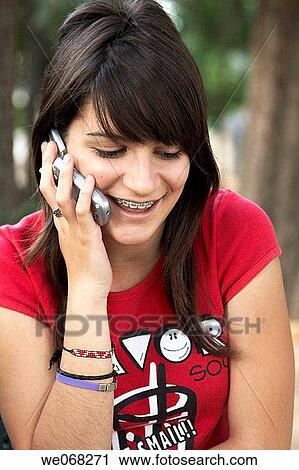 amusement, calling, brunette, brace, adolescence View Large Photo Image Stock Image - amusement, calling, brunette, brace, adolescence. Fotosearch