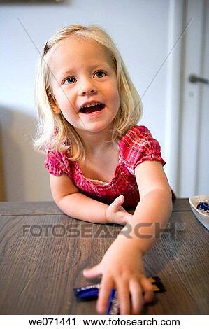 Stock Image - anticipation, blond, baby, at-home, 3-4 years. Fotosearch