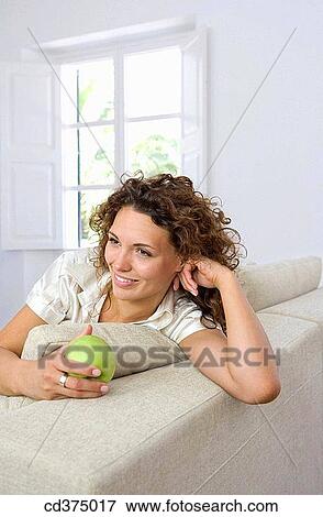 apple, brunette, at-home, 20's View Large Photo Image Stock Photo - apple, brunette, at-home, 20's. Fotosearch