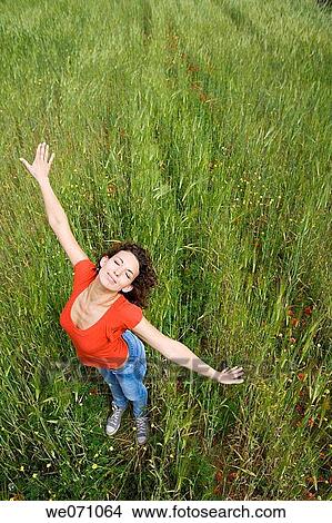 Arms open, carefree, brunette, 20's View Large Photo Image Picture - Arms open, carefree, brunette, 20's. Fotosearch