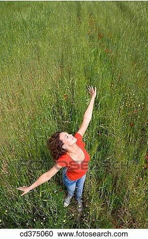 Arms open, carefree, brunette, 20's View Large Photo Image Stock Image - Arms open, carefree, brunette, 20's. Fotosearch