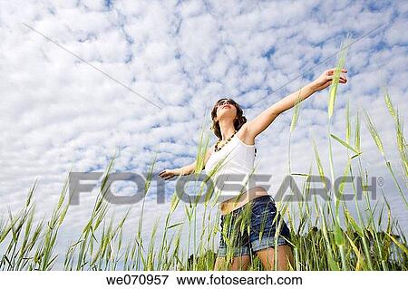 Arms open, carefree, brunette, 20's View Large Photo Image Stock Photo - Arms open, carefree, brunette, 20's. Fotosearch