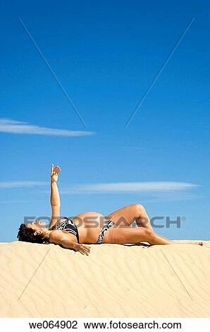 Arms raised, beach, 30's View Large Photo Image Stock Image - Arms raised, beach, 30's. Fotosearch