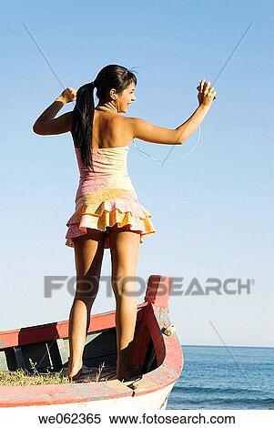 Arms raised, brunette, boat, back view, amusement View Large Photo Image Stock Photography - Arms raised, brunette, boat, back view, amusement. Fotosearch