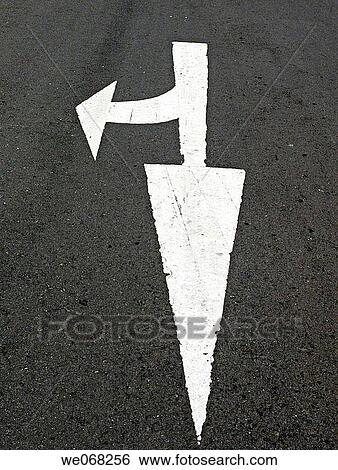 Stock Photograph - Arrows are marked on a highway for dircted the Subway. Pune, Maharashtra, India.. Fotosearch