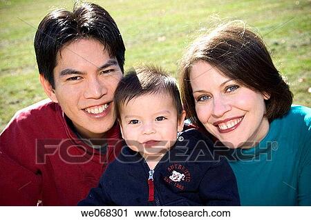 Asian husband and his white wife with their Eurasian toddler son View Large Photo Image Stock Image - Asian husband and his white wife with their Eurasian toddler son. Fotosearch