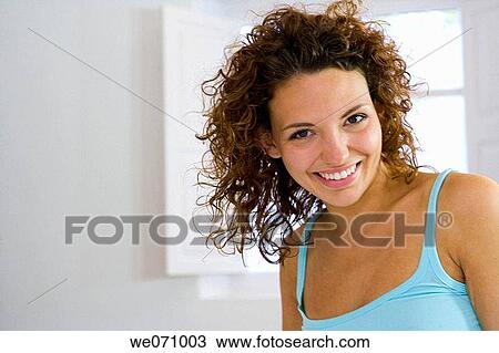 Stock Image - at-home, brunette, 20's. Fotosearch