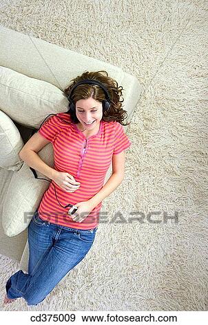 Stock Photo - at-home, brunette, barefoot, 20's. Fotosearch