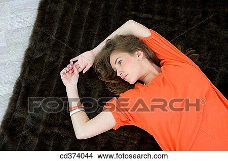 at-home, chilling out, brunette, absorbed View Large Photo Image Picture - at-home, chilling out, brunette, absorbed. Fotosearch