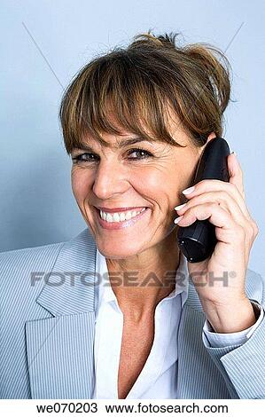 Stock Image - baby boomer, business, businesspeople, businesswoman, calling. Fotosearch