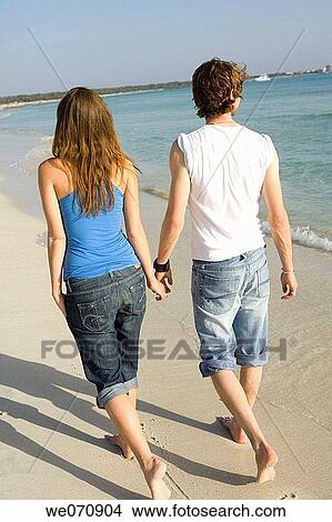back view, bond, beach, barefoot, 20's View Large Photo Image Picture - back view, bond, beach, barefoot, 20's. Fotosearch