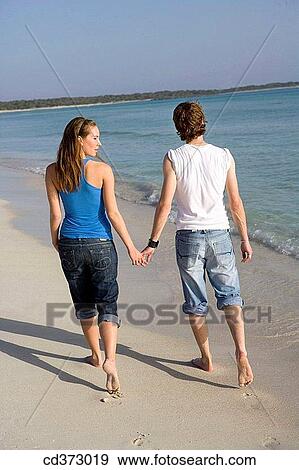 back view, bond, beach, barefoot, 20's View Large Photo Image Stock Photo - back view, bond, beach, barefoot, 20's. Fotosearch