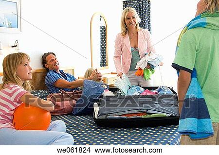 Picture - baggage, boy, bed, accommodation. Fotosearch