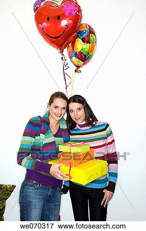 balloon, Birthday party, brunette, carry View Large Photo Image Stock Photo - balloon, Birthday party, brunette, carry. Fotosearch