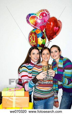 Stock Image - balloon, Birthday party, brunette. Fotosearch