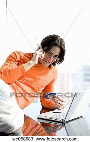 Bank card, calling, black hair, 20's View Large Photo Image Stock Image - Bank card, calling, black hair, 20's. Fotosearch