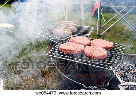 barbque food sizzeling on an outdoor barbque View Large Photo Image Stock Photo - barbque food sizzeling on an outdoor barbque. Fotosearch