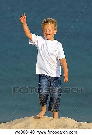 barefoot, boy, blond, beach, Arms raised View Large Photo Image Stock Image - barefoot, boy, blond, beach, Arms raised. Fotosearch