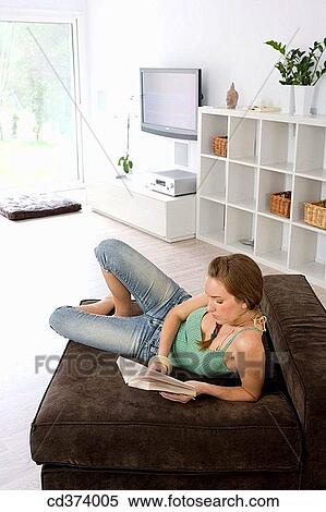 barefoot, brunette, book, at-home View Large Photo Image Stock Photography - barefoot, brunette, book, at-home. Fotosearch