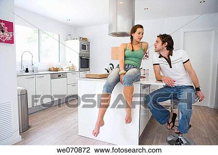 Stock Image - barefoot, chat, at-home. Fotosearch
