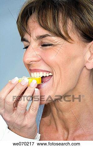 bite, Citrus fruit, biting, acid View Large Photo Image Stock Photo - bite, Citrus fruit, biting, acid. Fotosearch