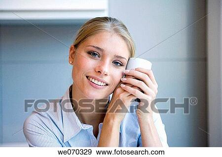 Stock Photo - blond, blue eyes, break, break-time. Fotosearch