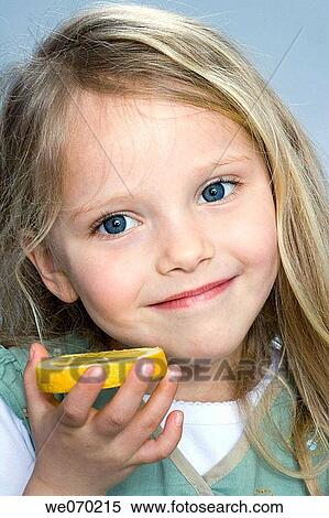 blond, Citrus fruit, child, blue eyes, acid View Large Photo Image Stock Photography - blond, Citrus fruit, child, blue eyes, acid. Fotosearch