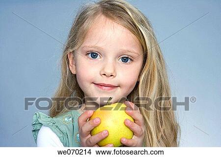 blond, Close-up, child, blue eyes, apple View Large Photo Image Picture - blond, Close-up, child, blue eyes, apple. Fotosearch