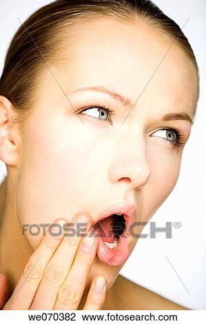 Stock Image - blue eyes, brunette, Close-up. Fotosearch