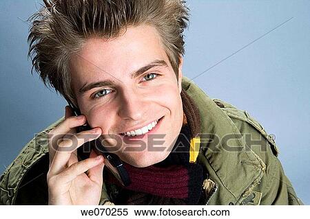 Stock Photography - blue eyes, Close-up, cell phone, adolescence. Fotosearch