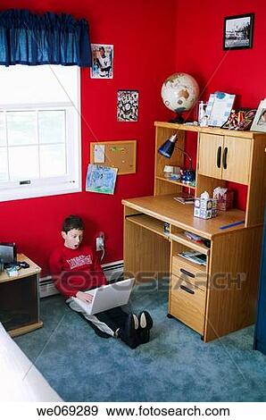 Boy Surfing the Internet on Laptop View Large Photo Image Stock Photo - Boy Surfing the Internet on Laptop. Fotosearch