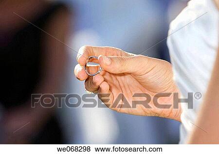 Bride holding wedding ring View Large Photo Image Stock Photo - Bride holding wedding ring. Fotosearch