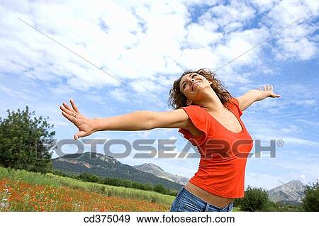 brunette, carefree, Arms open View Large Photo Image Stock Photo - brunette, carefree, Arms open. Fotosearch
