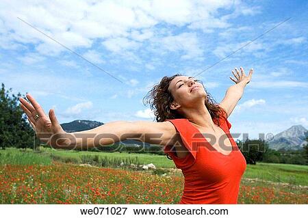 Stock Photo - brunette, carefree, Arms open. Fotosearch