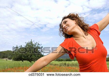 brunette, carefree, calm, Arms open View Large Photo Image Stock Image - brunette, carefree, calm, Arms open. Fotosearch