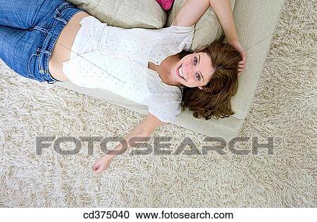brunette, carpet, carefree, at-home View Large Photo Image Stock Image - brunette, carpet, carefree, at-home. Fotosearch