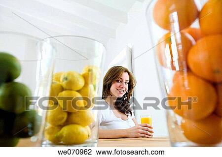 brunette, Citrus fruit, 20's View Large Photo Image Stock Image - brunette, Citrus fruit, 20's. Fotosearch