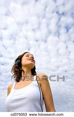 Stock Image - brunette, cloudy, cloud, 20's. Fotosearch