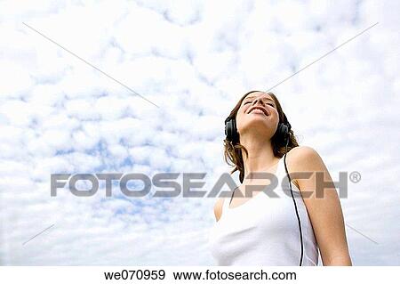 Stock Photo - brunette, cloudy, cloud, 20's. Fotosearch