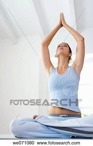 brunette, concentrate, Arms raised View Large Photo Image Stock Image - brunette, concentrate, Arms raised. Fotosearch