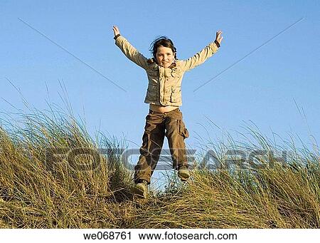 carefree, Arms open, blue sky, blue, Arms raised, amusement View Large Photo Image Stock Image - carefree, Arms open, blue sky, blue, Arms raised, amusement. Fotosearch