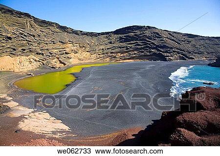 Charco de los Clicos green lagoon and beach, El Golfo. Lanzarote, Canary Islands, Spain View Large Photo Image Stock Image - Charco de los Clicos green lagoon and beach, El Golfo. Lanzarote, Canary Islands, Spain. Fotosearch
